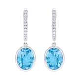 Oval Cut Swiss Blue Topaz and Diamond Earrings (0.16 ctw)